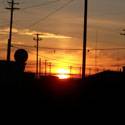 Sunset photo between telephone poles.